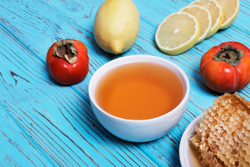 Traditional medicine. Honey and honeycombs, lemon and ginger. Ingredients for tea. Place for text. Top view.