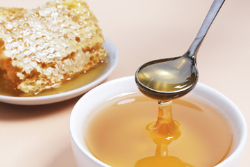 Beautiful sweet honey with honeycombs on the background. Place for text. Top view, flat lay.