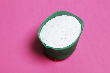 Washing powder on a pink background