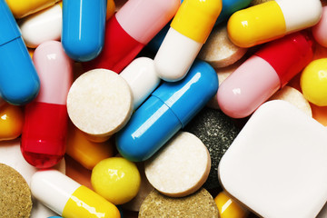 Pills as a background. Vitamins and antibiotics. Place for text. Top view.
