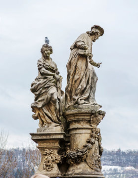 Prague, Czech Republic, Charles bridge. Sculpture " St. Ivo in Femida's society." Saint Ivo is the patron Saint of justice.