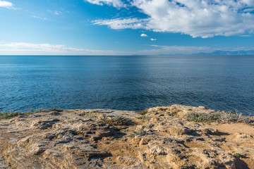 Fototapeta na wymiar Blue Mediterranean Sea from a Rocky Promontory on a Sunny Day
