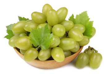 Green grapes on the plate isolated on white