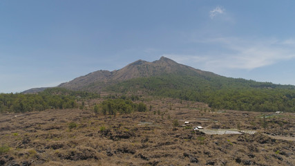 Aerial view volcano batur covered with vegetation mountain landscape with volcano sky and clouds Bali, Indonesia. Travel concept.