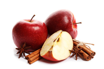 Juicy ripe apples with cinnamon and star anise isolated on white background. Ingredients for mulled wine.