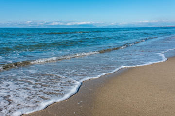 Fototapeta na wymiar Sandy Beach on the Southern Italian Coast on a Sunny Day