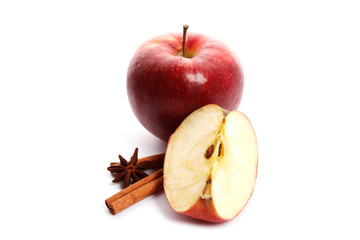 Juicy ripe apples with cinnamon and star anise isolated on white background. Ingredients for mulled wine.