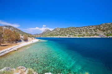 Turquoise waters of mediterranean and aegean sea with cliffs. Marmaris/Mugla. Greece and Turkish peninsula.