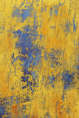 view of the part of the surface of the iron with the old cracked yellow paint