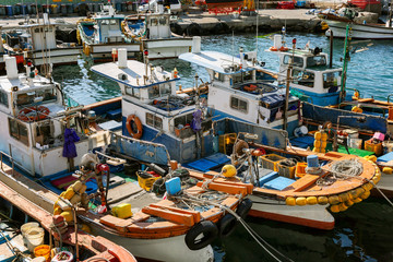 Old colorful fishing boats in the port, close-up