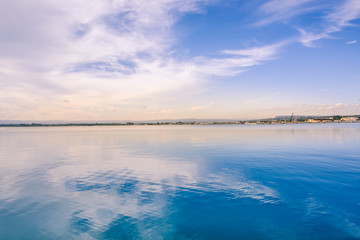 Seaside sunset - sky reflected in water - long exposure