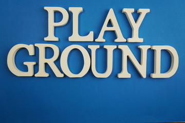Fototapeta na wymiar Playground word alphabet letters on blue background