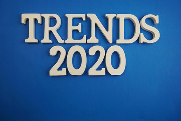 Trends 2020 word alphabet letters on blue background