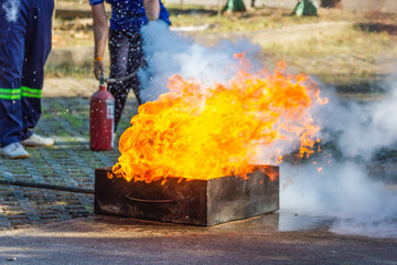 The expert demonstrates how to suppress fire from gas tanks.