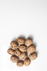 Useful walnuts, close-up, isolated on white background.