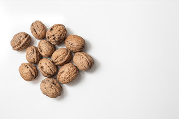 Useful walnuts, close-up, isolated on white background.