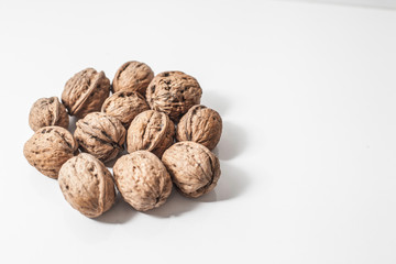 Useful walnuts, close-up, isolated on white background.