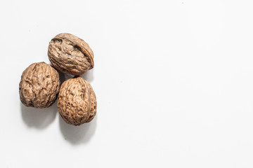 Useful walnuts, close-up, isolated on white background.