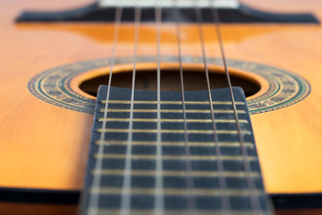 Fototapeta premium Closeup wooden classical guitar. Old classical guitar with nylon strings. Old acoustic guitar