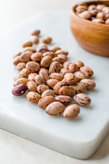 Raw Dry Pinto Beans on Marble Board / Kidney Beans.