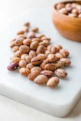 Raw Dry Pinto Beans on Marble Board / Kidney Beans.