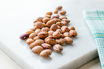 Raw Dry Pinto Beans on Marble Board / Kidney Beans.