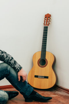 Male legs in and guitar