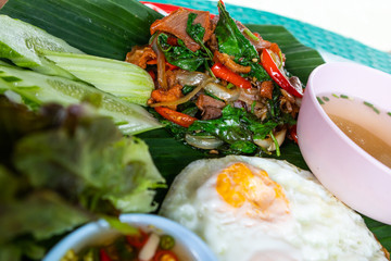 Fried rice with basil in a tray.