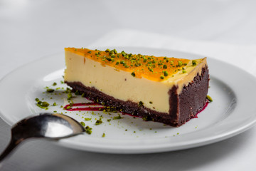 Delicious and homemade cheesecake with orange and lemon and chocolate