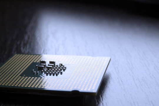 processor chip lie on wooden table