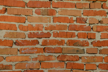 Brick wall with sloppy red brick masonry