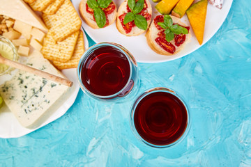 Italian antipasti wine snacks set. Brushettas on blue background.