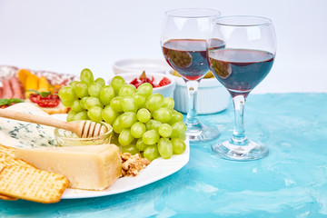 Italian antipasti wine snacks set. Brushettas on blue background.