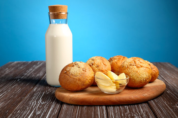 Bread rolls, with butter and milk.