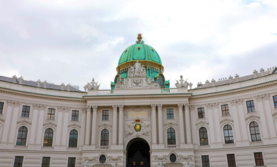 Fototapeta na wymiar Hofburg palace on St. Michael square (Michaelerplatz), Vienna, Austria