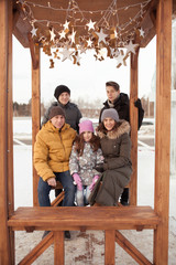 Obraz na płótnie Canvas Walk large family in winter ice playground,
