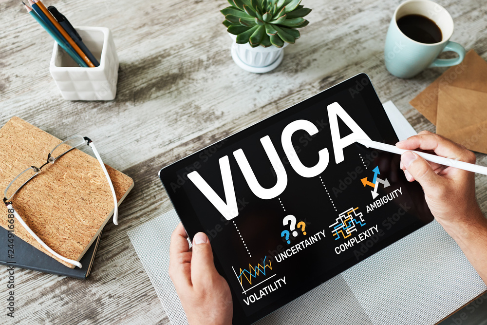 Poster vuca world concept on screen. volatility, uncertainty, complexity, ambiguity.