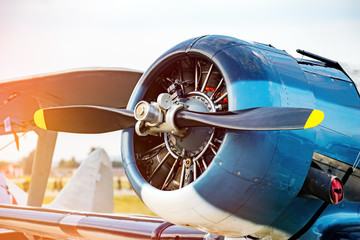 Fragment propeller with engine and retro airplane close up. Screw plane