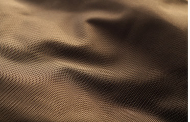 Brown color textile texture with blur effect.