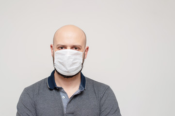 man in a medical mask. concept of an epidemic, influenza, protection from disease.