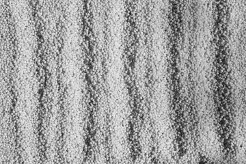 Millet groats close-up in black and white.
