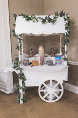 Fototapeta na wymiar wedding confectionery sweet cart