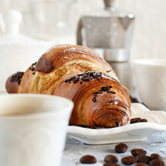 Breakfast with coffee and croissant