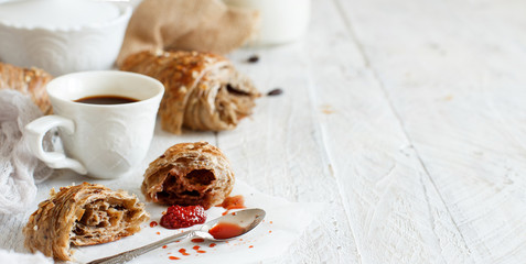 Breakfast with coffee and croissant