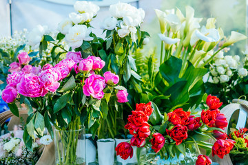 Beautiful pink peonies, yellow ranunculus flower bouquet and others. Spotted on the flower market.