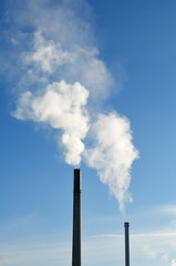 smoking chimneys in industrial area