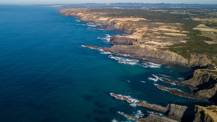 Fototapeta na wymiar Aerial view of the Cabo Sardao cliffs and Waves Atlantic coast Portugal