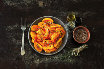 Healthy salad with yellow tomatoes and spices. Bright salad bowl. Vegan healthy salad.