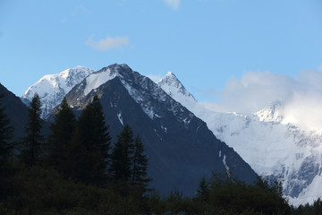 Fototapeta na wymiar Mt Boris and Bronya on the background of Mt Belukha, Katunsky Ridge, Altai, Russia