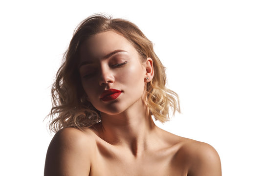 Closeup of naked beautiful woman posing with closed eyes